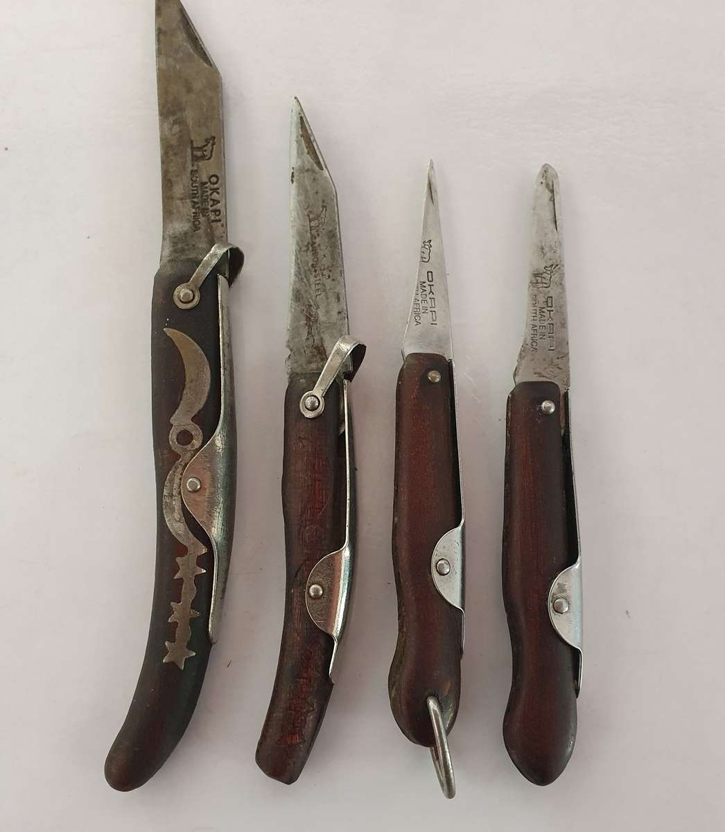 4 X VINTAGE ORIGINAL OKAPI FOLDING KNIFES. INCL. CARBON STEEL. WELL USED.