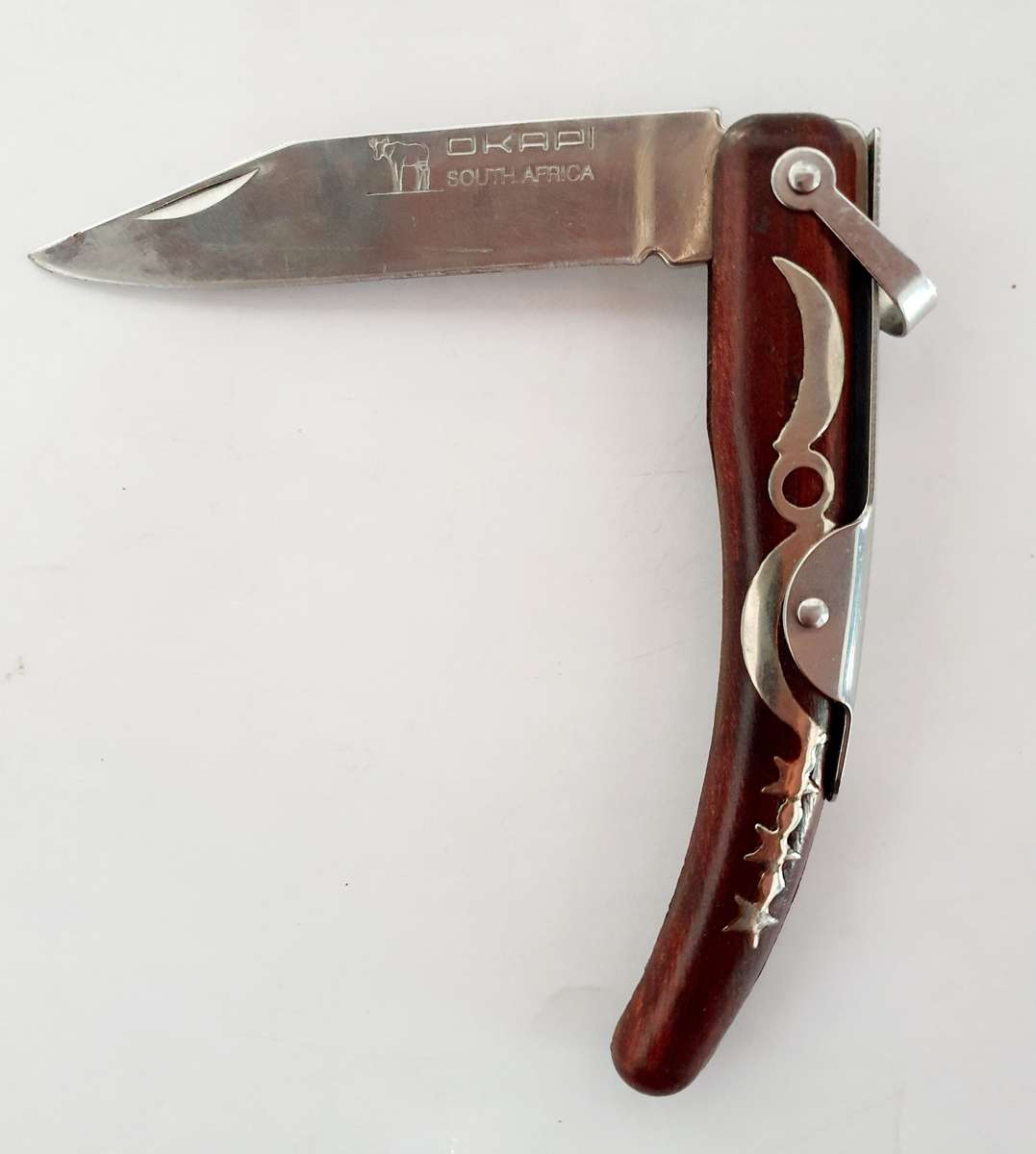 ORIGINAL OKAPI FOLDING KNIFE. ROSEWOOD. VERY GOOD CONDITION.