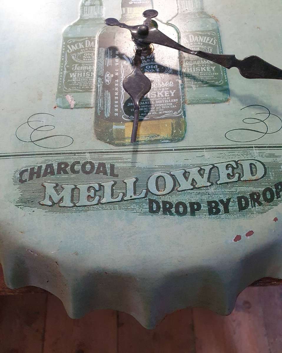 VINTAGEJACK DANIELS   HUGE EMBOSSED METAL BOTTLE LID SHAPE WATCH. 360mm DIA.