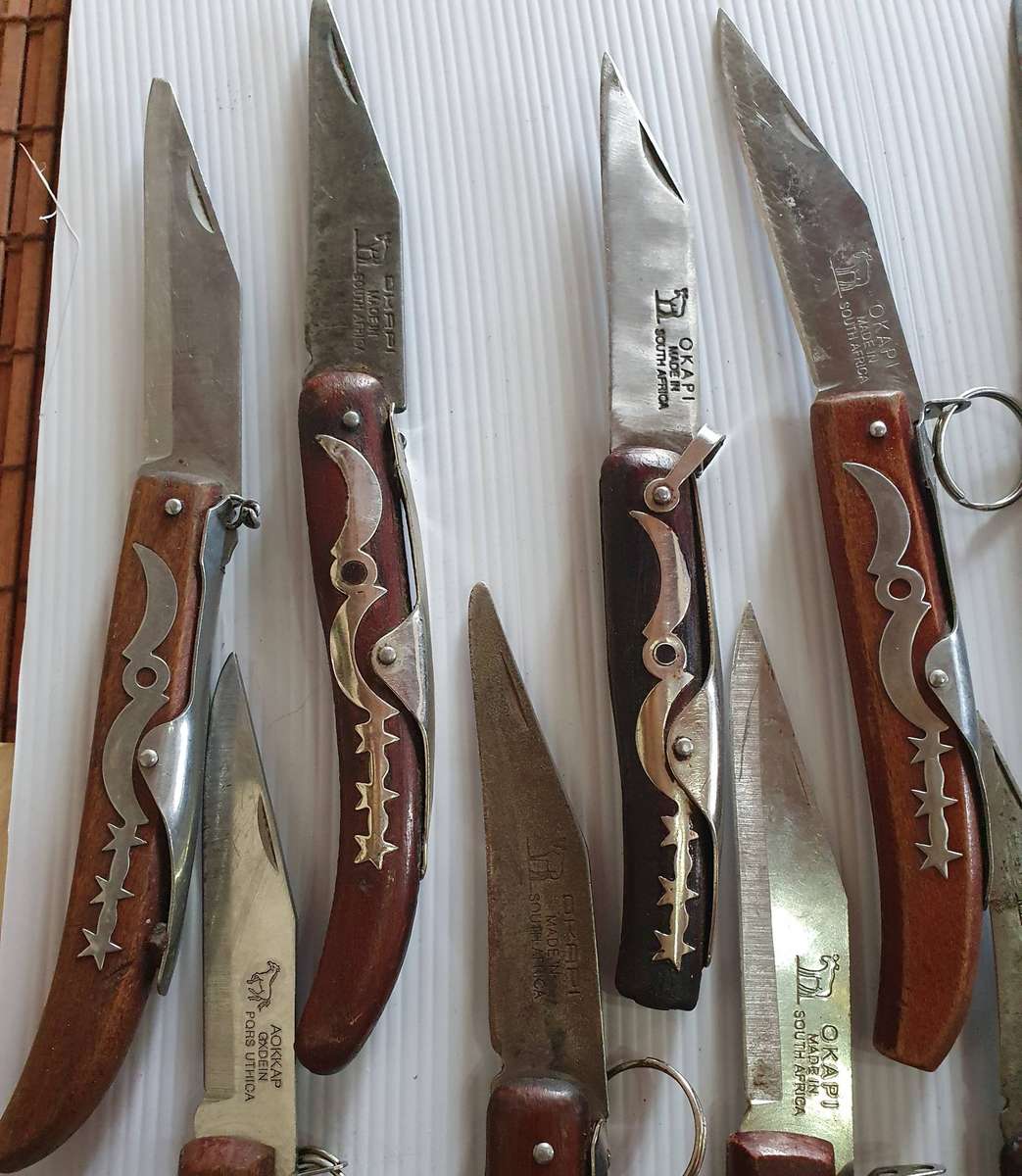 21 X OKAPI FOLDING KNIFES. WELL USED. ONE BID FOR ALL.