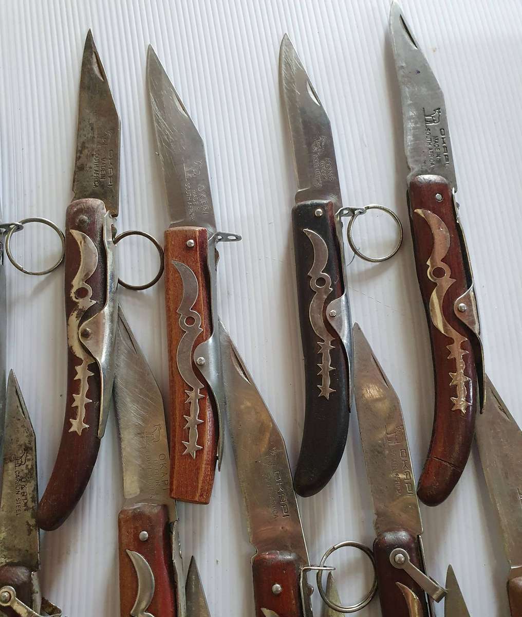 21 X OKAPI FOLDING KNIFES. WELL USED. ONE BID FOR ALL.