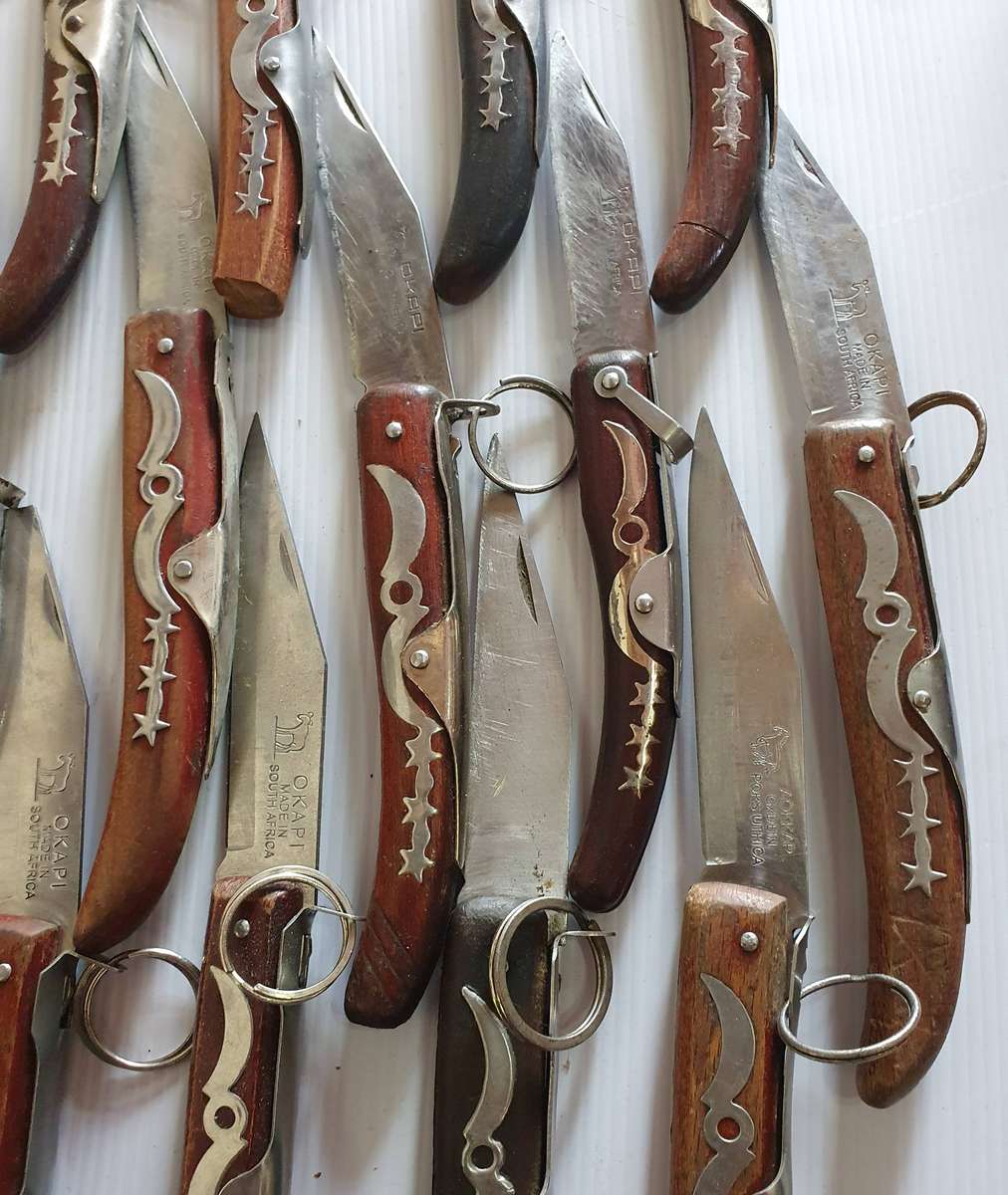 21 X OKAPI FOLDING KNIFES. WELL USED. ONE BID FOR ALL.