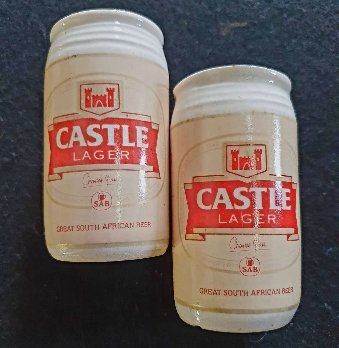 VINTAGE CASTLE LAGER BIG PORCELAIN SALT AND PEPPER SHAKERS.