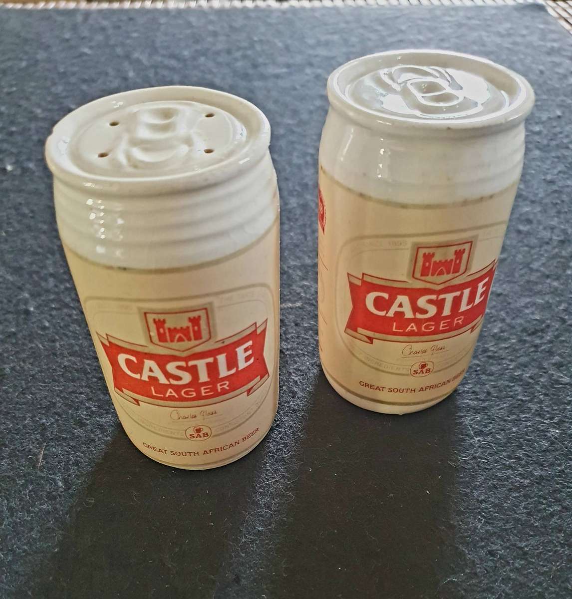 VINTAGE CASTLE LAGER BIG PORCELAIN SALT AND PEPPER SHAKERS.