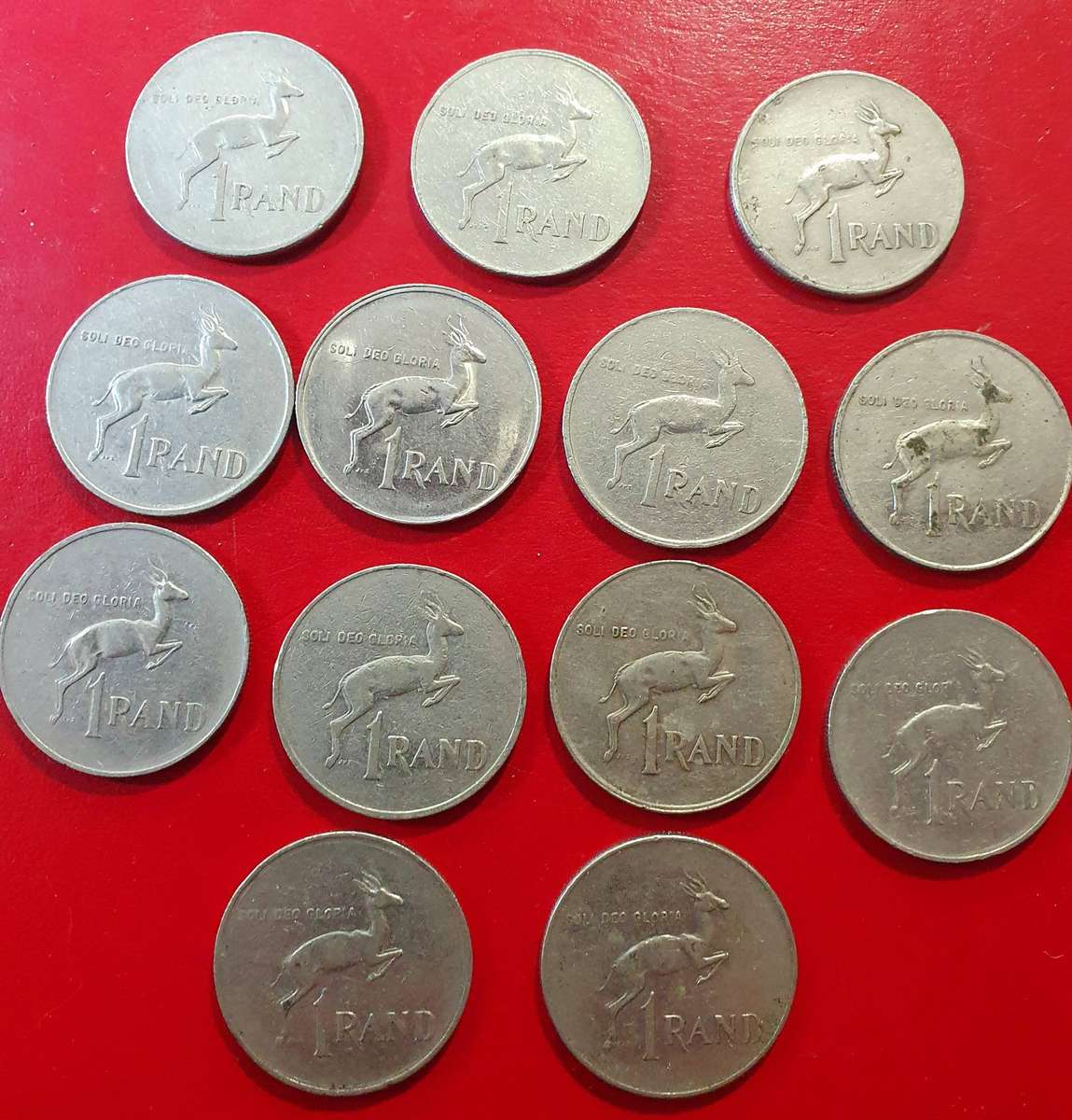13 X ONE RAND SA COINS. SOME EXCEPTIONAL CONDITION. VARIOUS DATES. ONE BID FOR ALL.