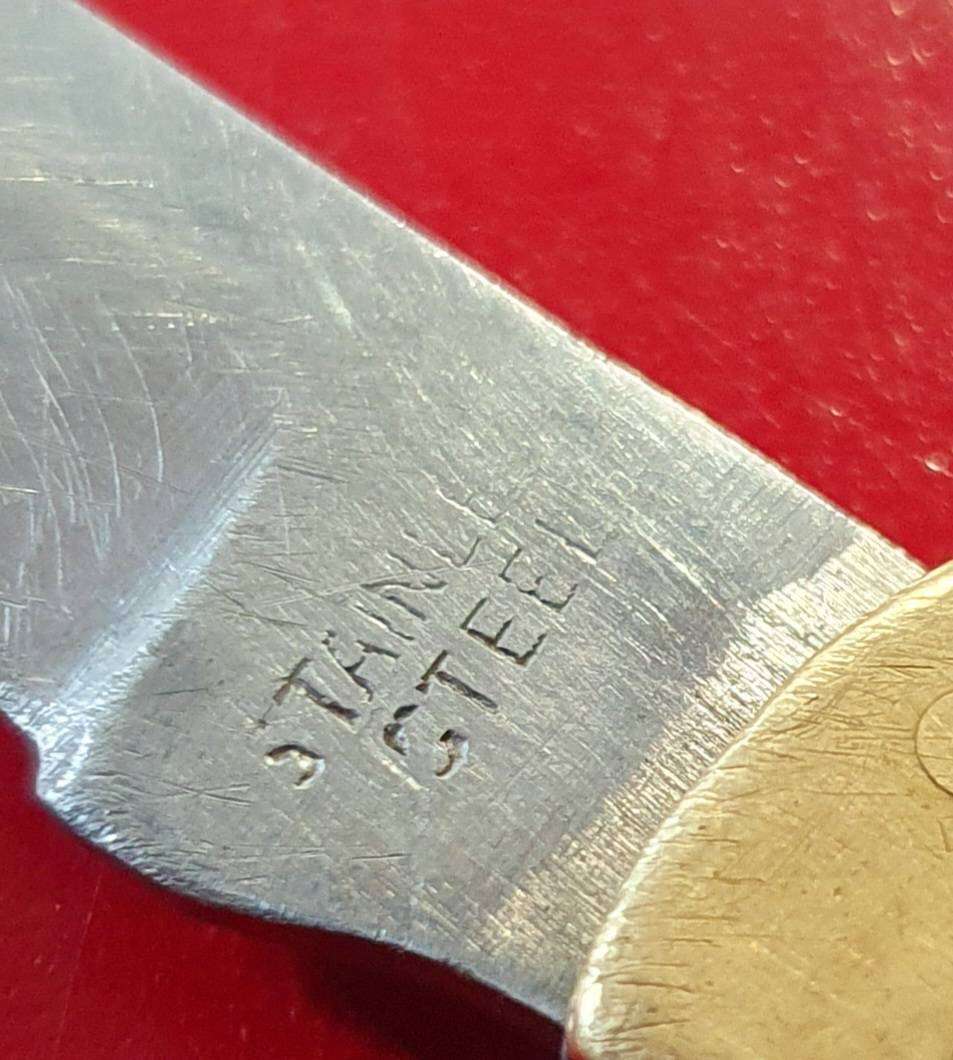 VINTAGE STAINLESS AND BRASS WITH WOOD FOLDING KNIFE.