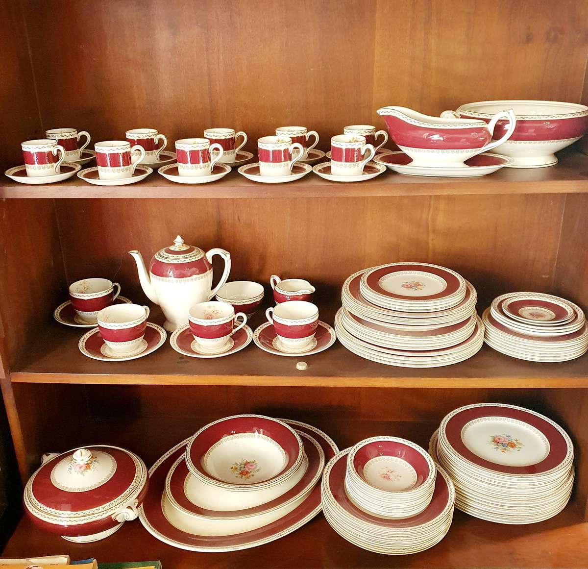 VINTAGE 102 PIECE CROWN DUCAL CHINA BURGUNDY FLORAL CENTER GOLD TRIM DINING SET.