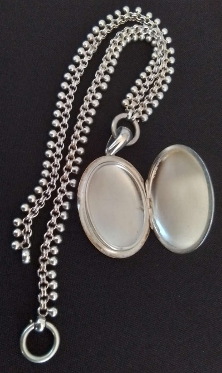 Silver Oval Pendant on Decorative Chain