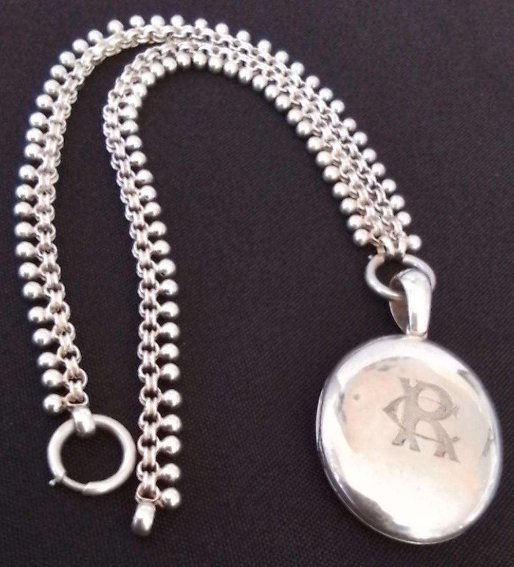 Silver Oval Pendant on Decorative Chain