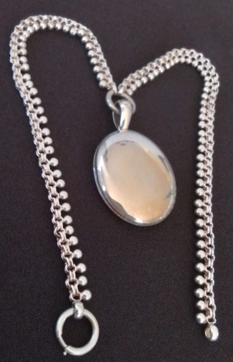 Silver Oval Pendant on Decorative Chain