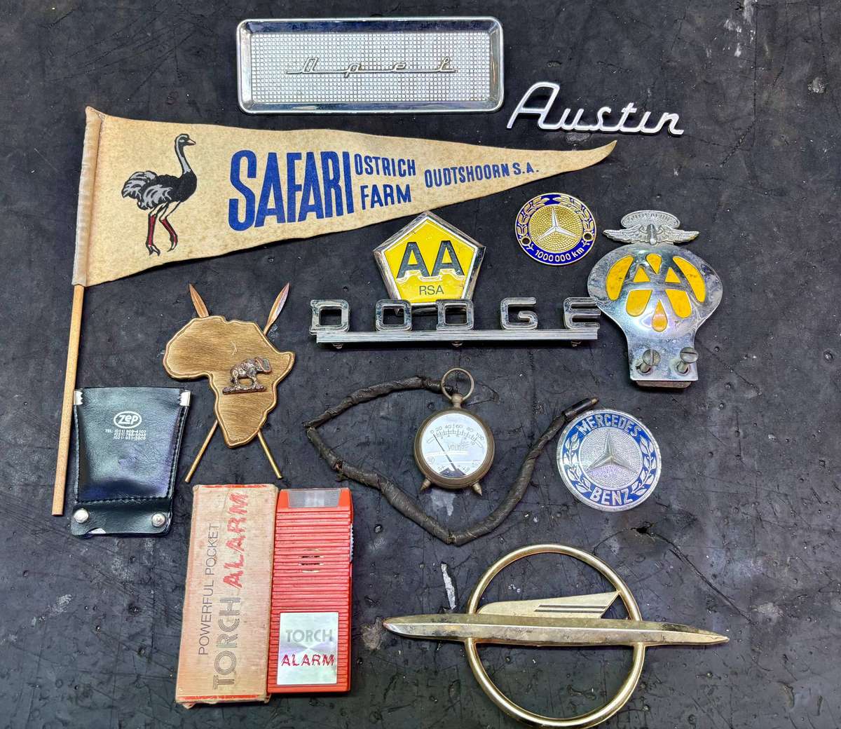 Assorted badges AA, Dodge, Opel, Austin, Mercedes Benz and more