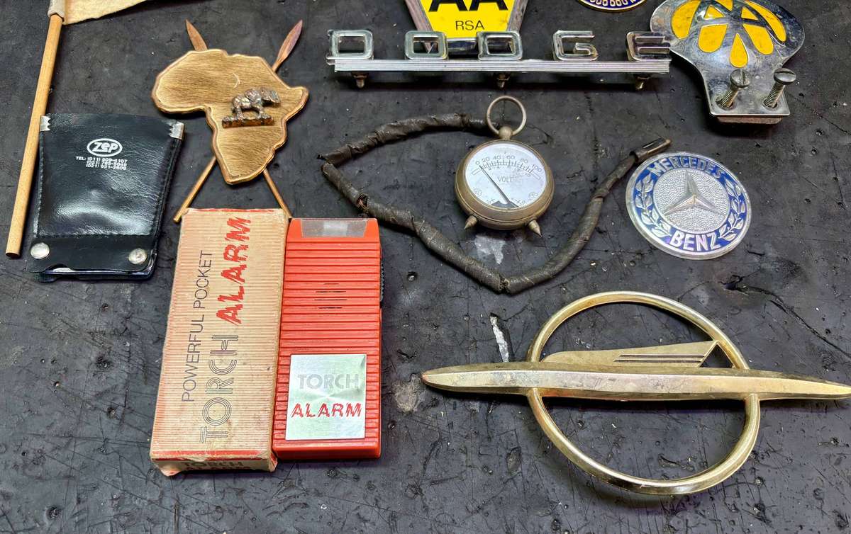 Assorted badges AA, Dodge, Opel, Austin, Mercedes Benz and more