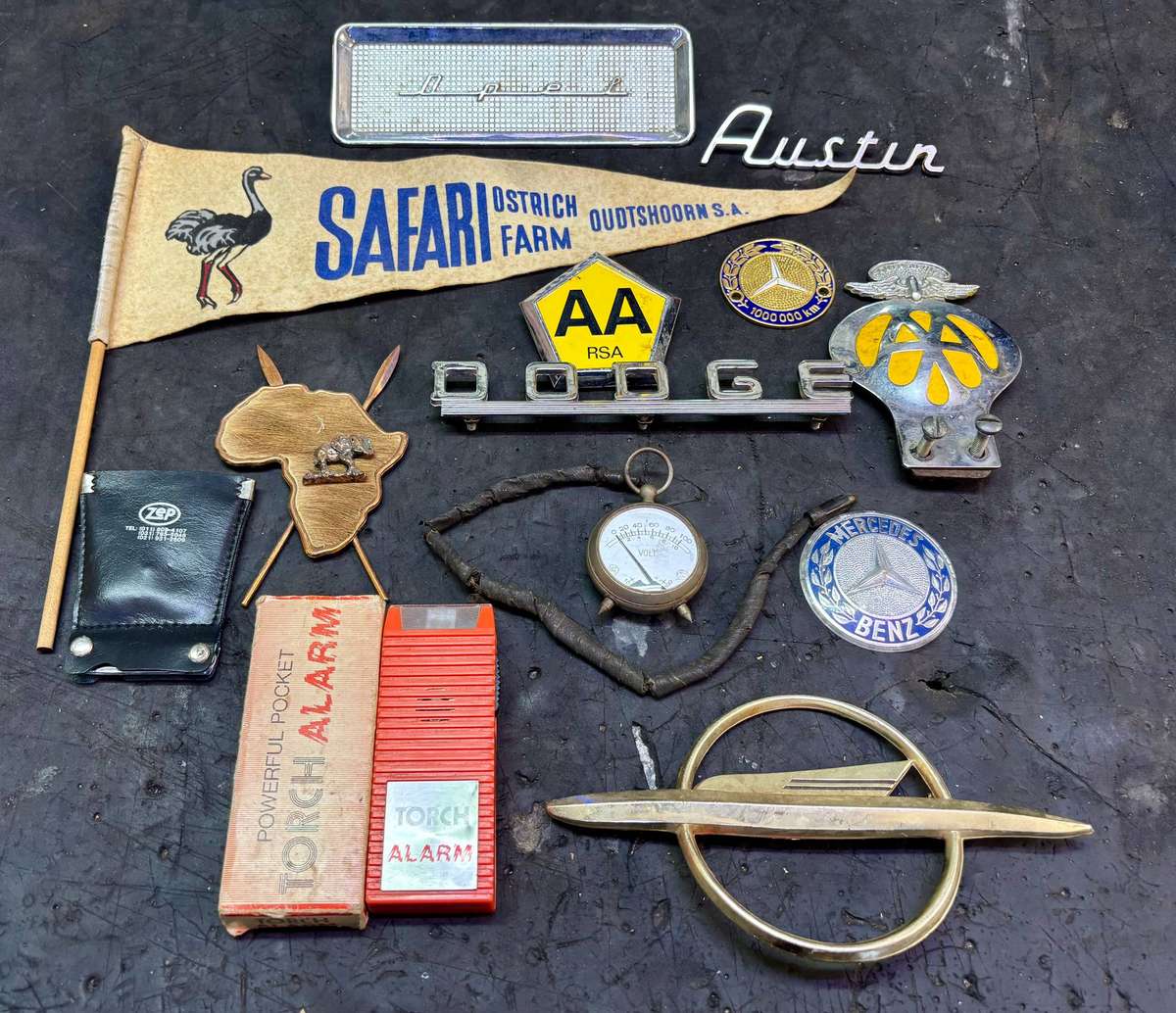 Assorted badges AA, Dodge, Opel, Austin, Mercedes Benz and more