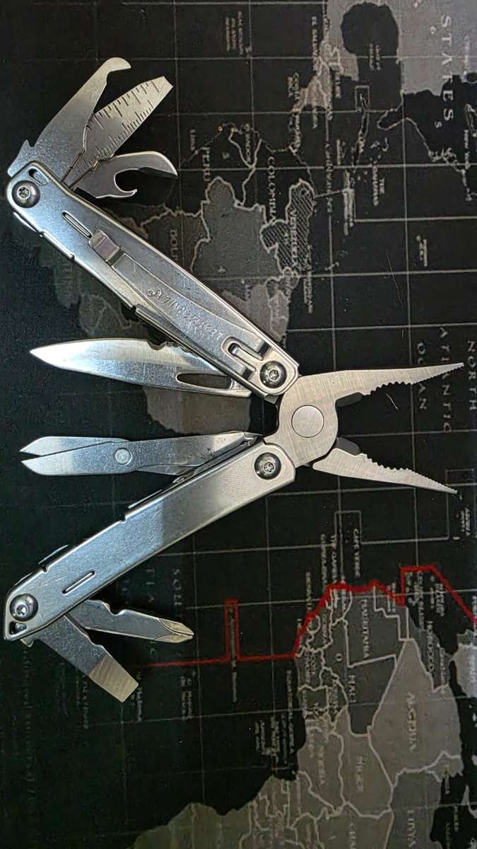 Leatherman Wingman (1st of 2 for sale) with generic nylon pouch.