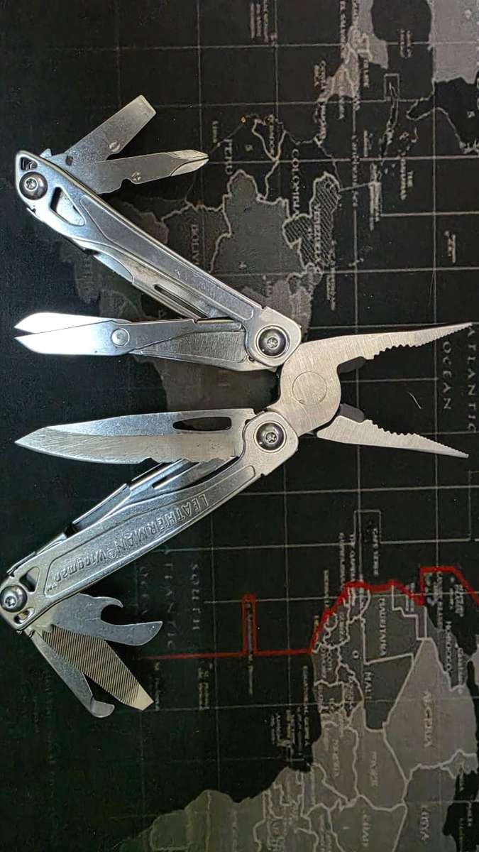 Leatherman Wingman (1st of 2 for sale) with generic nylon pouch.