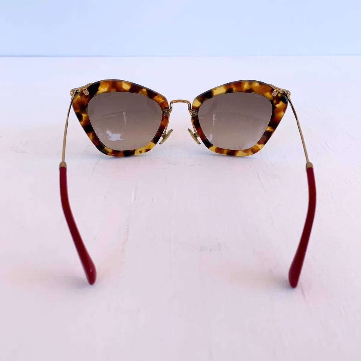 Miu Miu Cat Eye Sunglasses  Tortoise Shell / Red Arm Tips