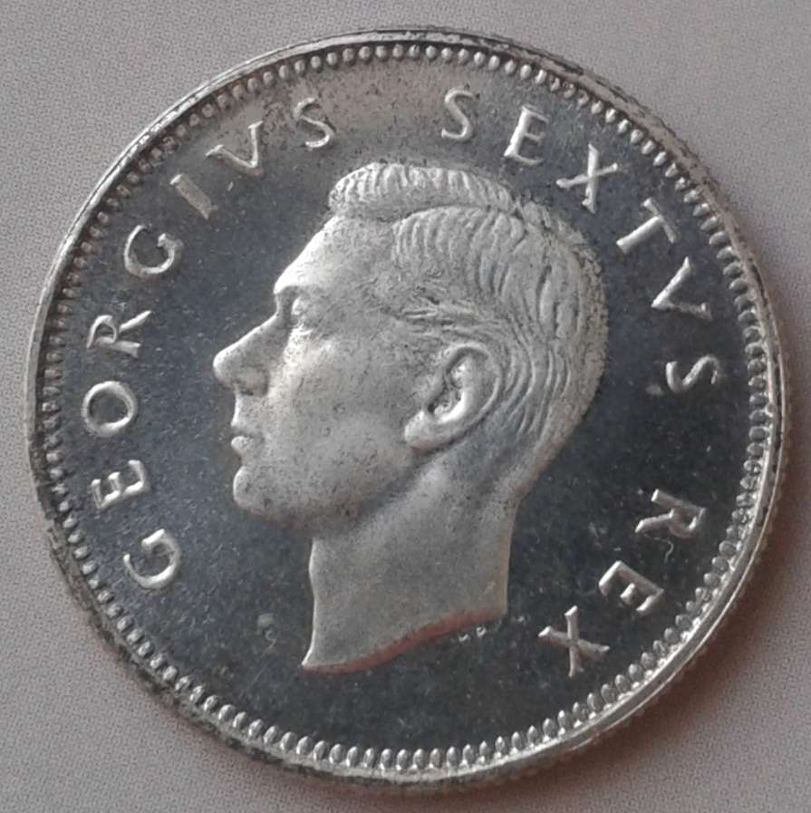 Nice 1952 union proof silver shilling.