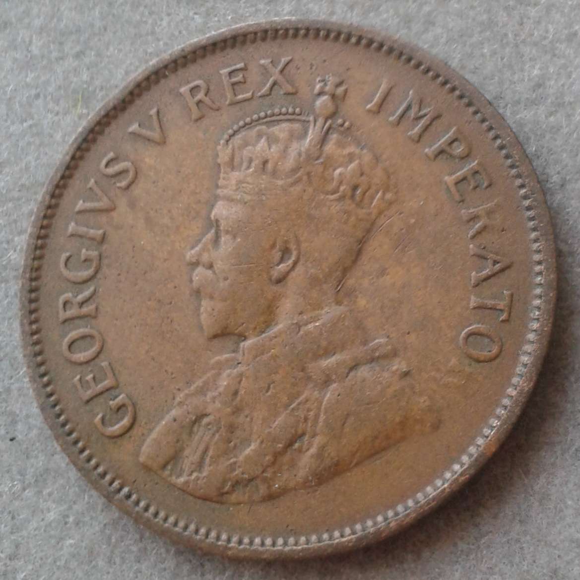 Lower mintage 1933 Union 1/2 penny with obverse struck through error