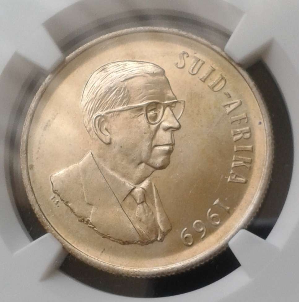 1969 Afrikaans silver R1 NGC MS62 with golden toning
