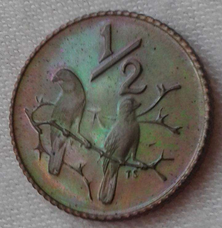 Encapsulated 1982 Republic proof 1/2c (mintage: 12000).