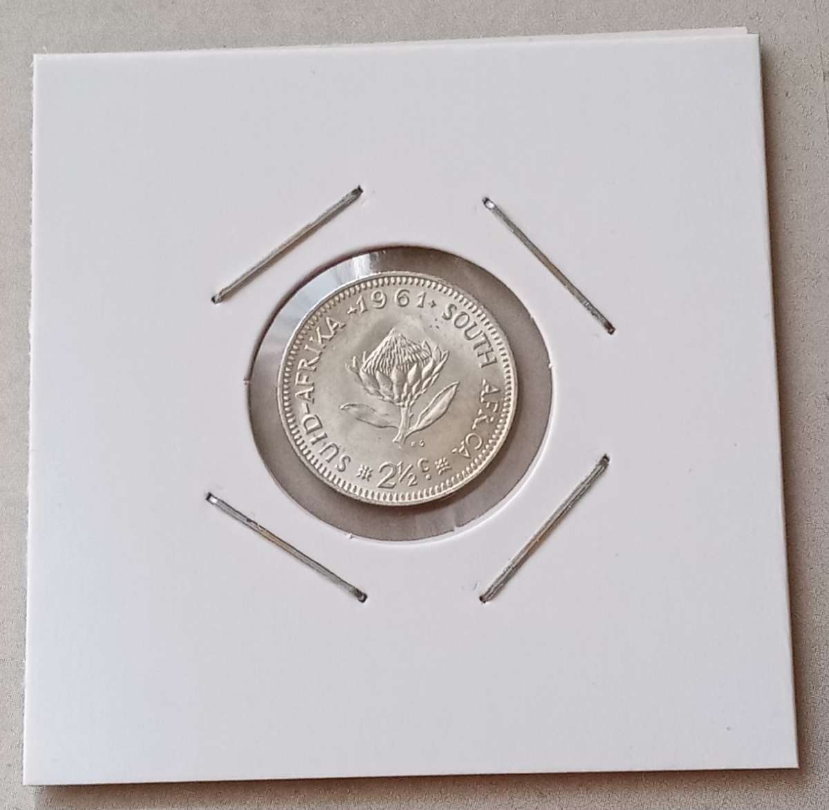 Uncirculated 1961 Republic silver 2 1/2c in coin flip