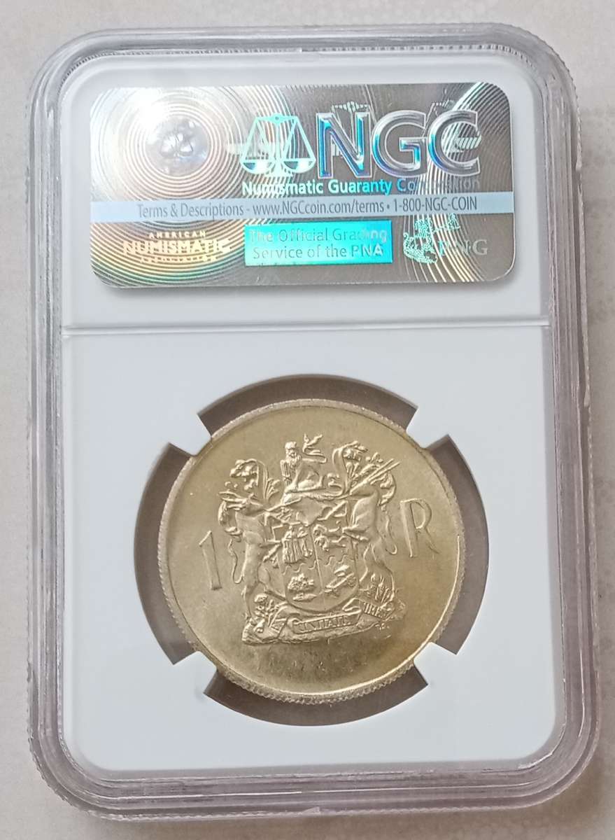 1969 Afrikaans silver R1 NGC MS62 with golden toning