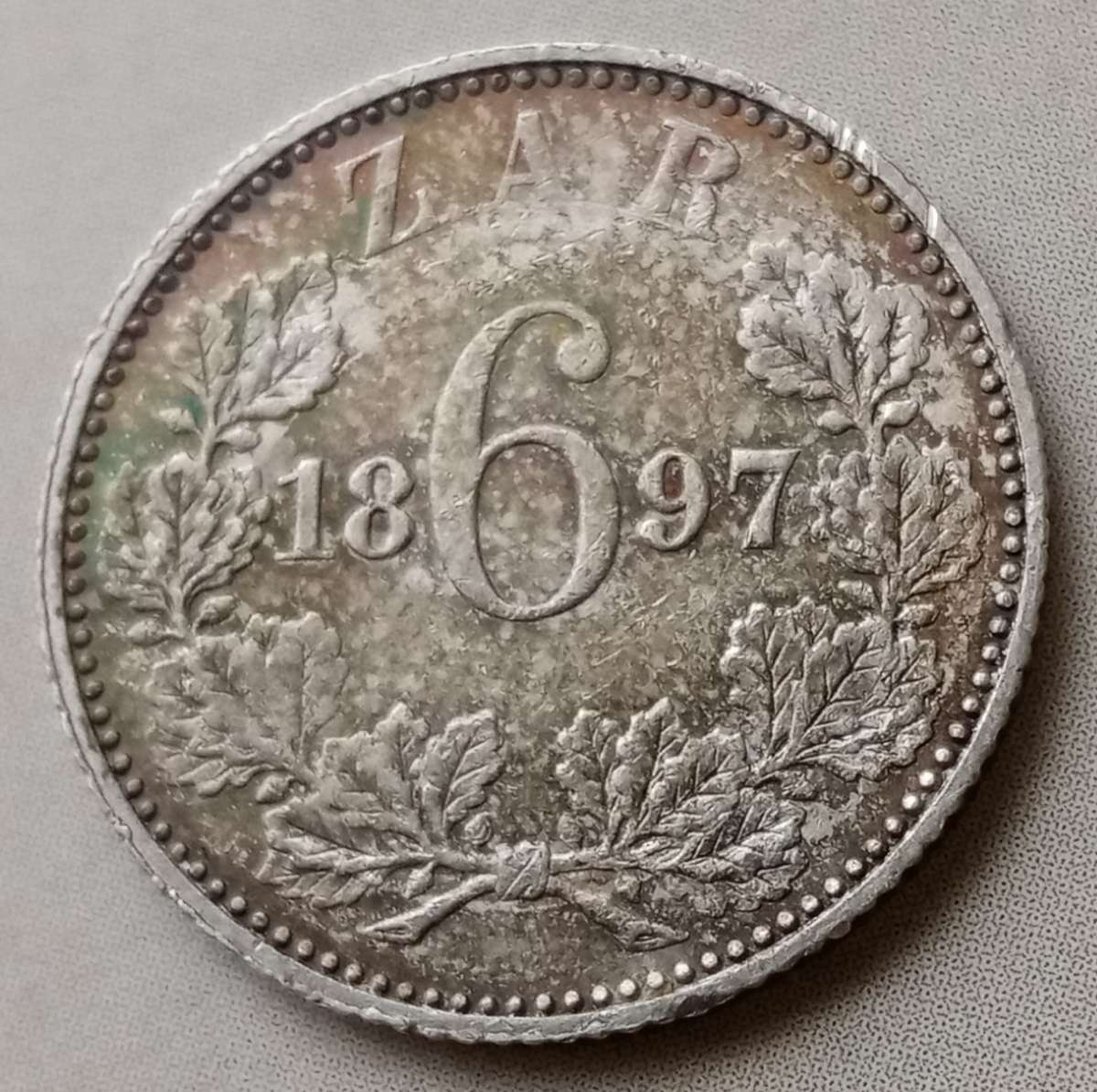 Nice grade 1897 ZAR Kruger silver sixpence with iridescent toning