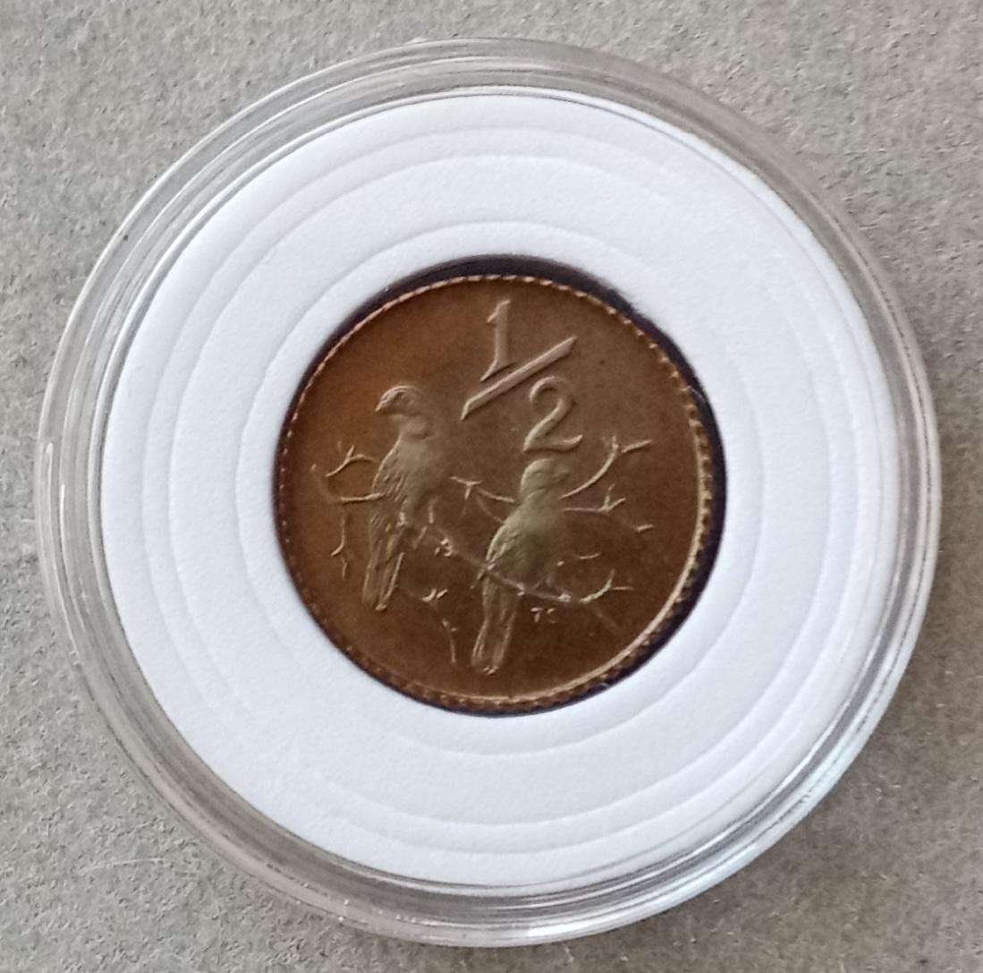 Encapsulated 1982 Republic proof 1/2c (mintage: 12000).