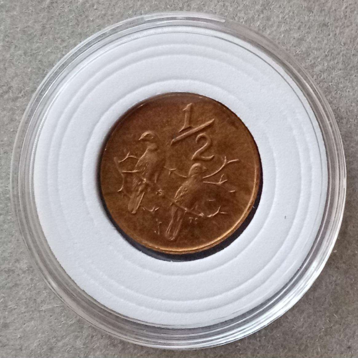 Encapsulated 1983 Republic proof 1/2c (mintage: 14135).