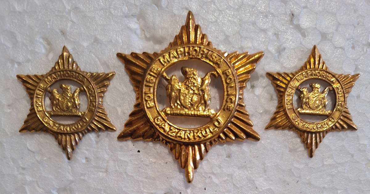 GAZANKULU POLICE CAP AND COLLAR BADGES SET - SCREWS AND PINS INTACT