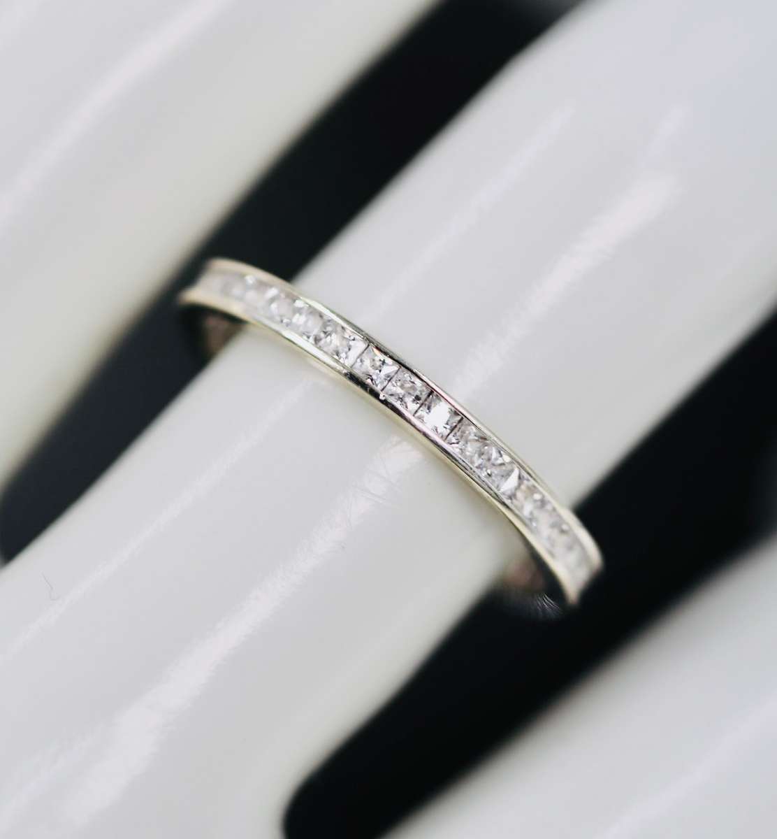 9ct  WHITE GOLD CHANNEL SET CUBIC ZIRCONIA ETERNITY RING. LONDON, ENGLAND HALLMARKED
