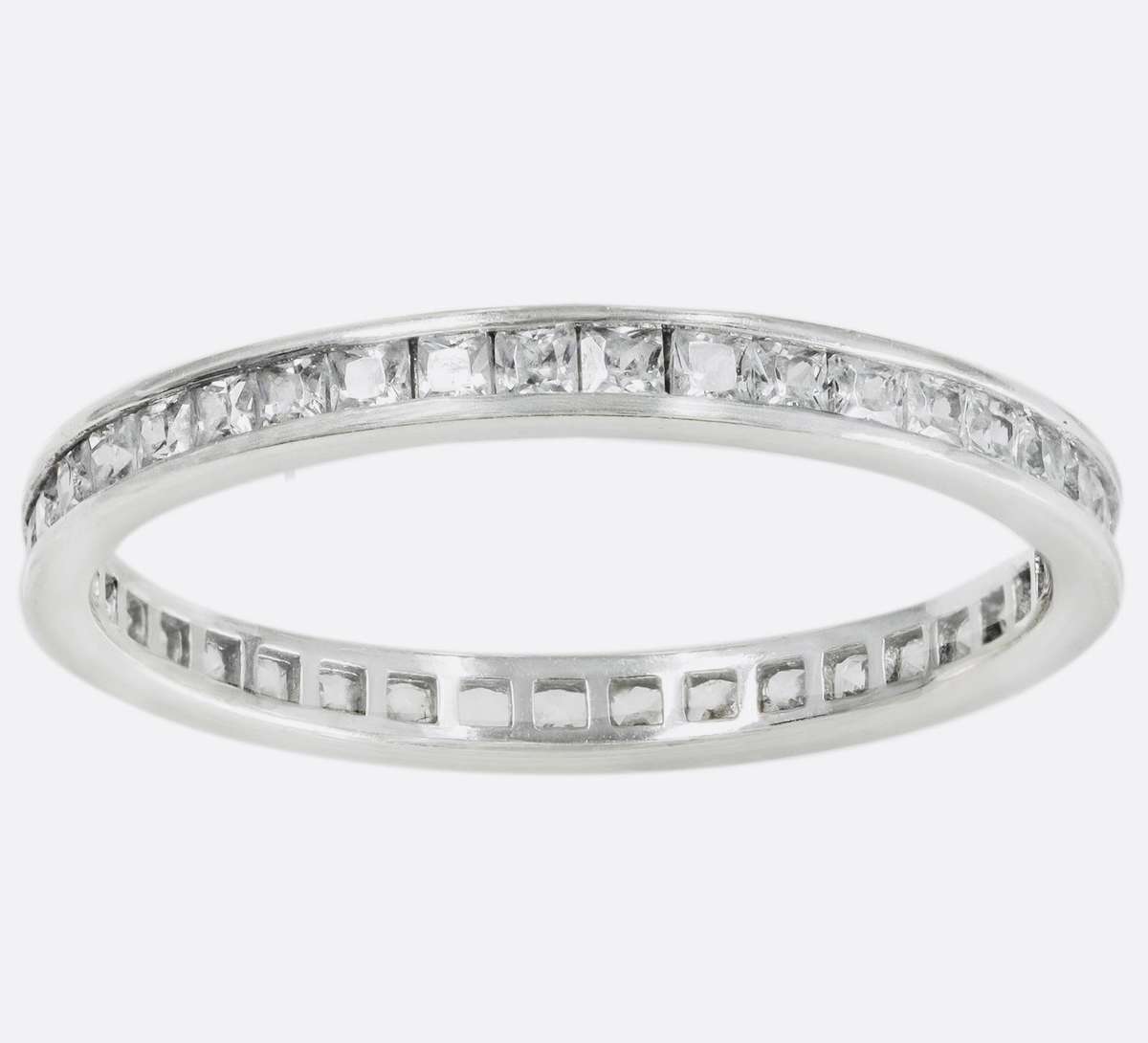 9ct  WHITE GOLD CHANNEL SET CUBIC ZIRCONIA ETERNITY RING. LONDON, ENGLAND HALLMARKED