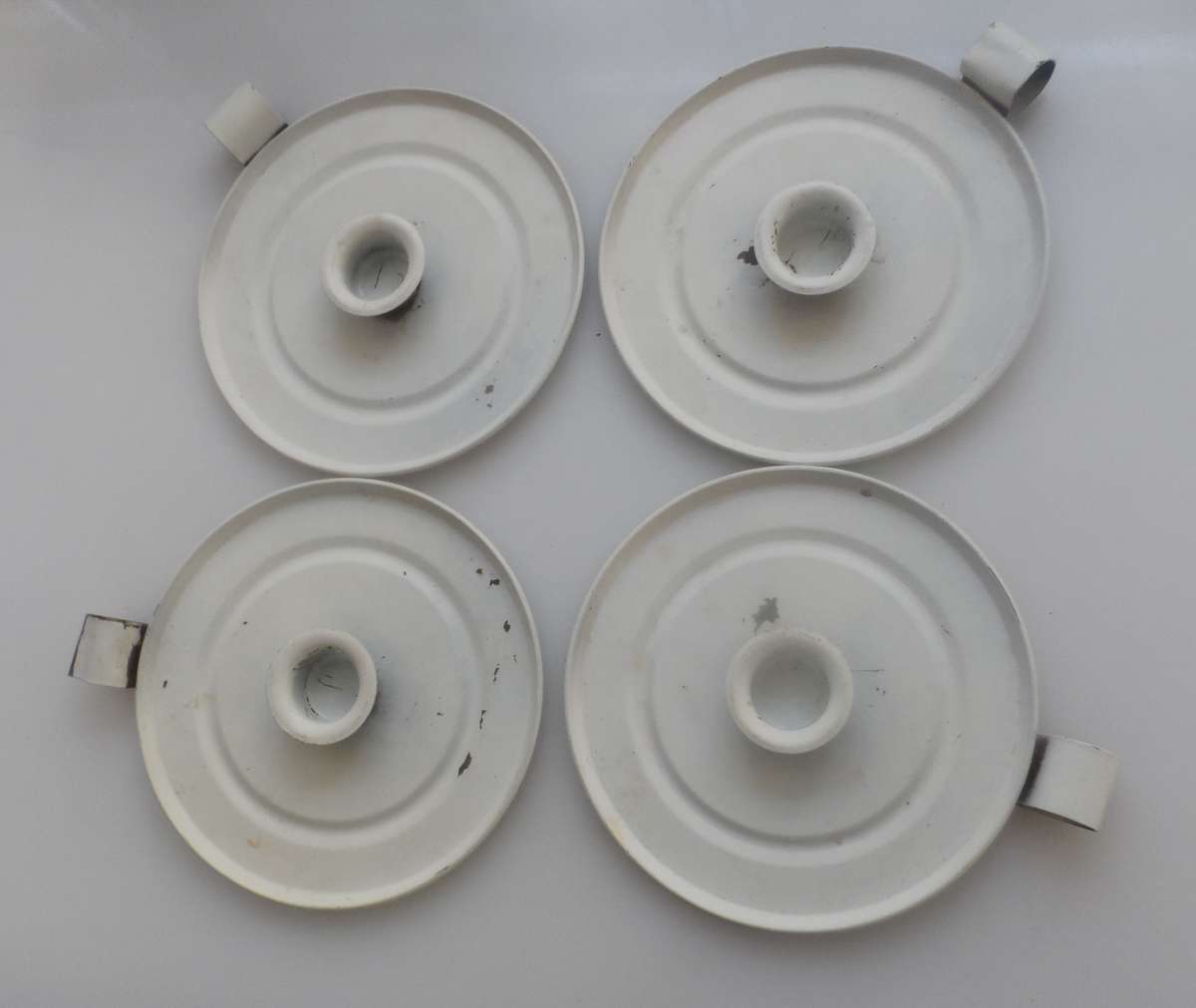 CANDLE STICK HOLDERS - VINTAGE SET OF FOUR , PRESSED TIN  , WHITE