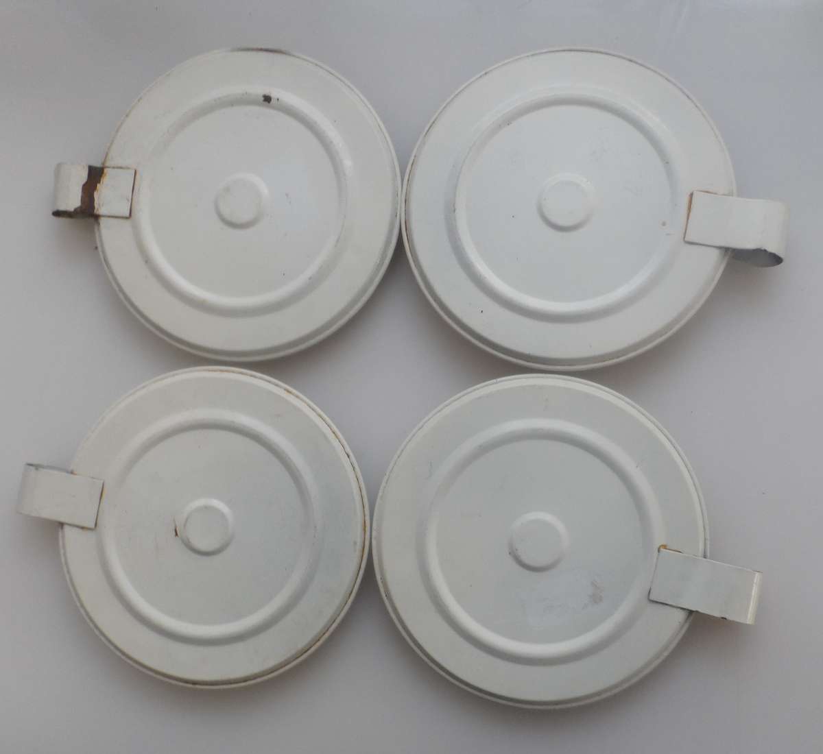 CANDLE STICK HOLDERS - VINTAGE SET OF FOUR , PRESSED TIN  , WHITE