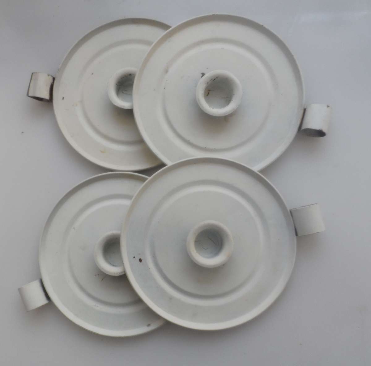 CANDLE STICK HOLDERS - VINTAGE SET OF FOUR , PRESSED TIN  , WHITE