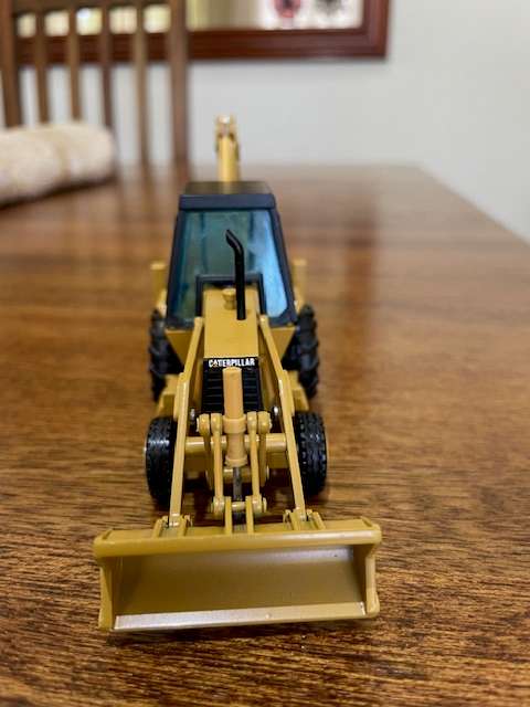 NZG - Caterpillar 428 Backhoe Loader with Hydraulic Hammer 1:50 scale