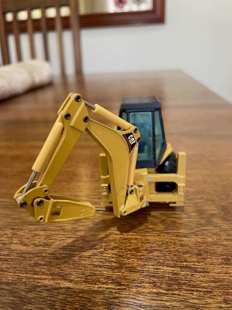 NZG - Caterpillar 428 Backhoe Loader with Hydraulic Hammer 1:50 scale