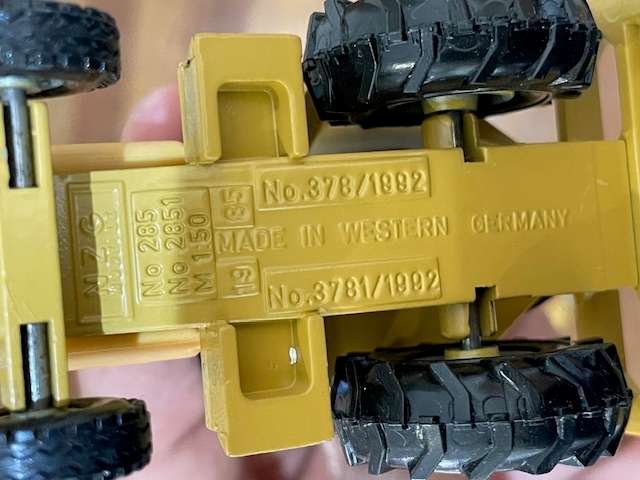 NZG - Caterpillar 428 Backhoe Loader with Hydraulic Hammer 1:50 scale