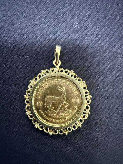 1/10th Gold Krugerrand set in 9ct gold pendant