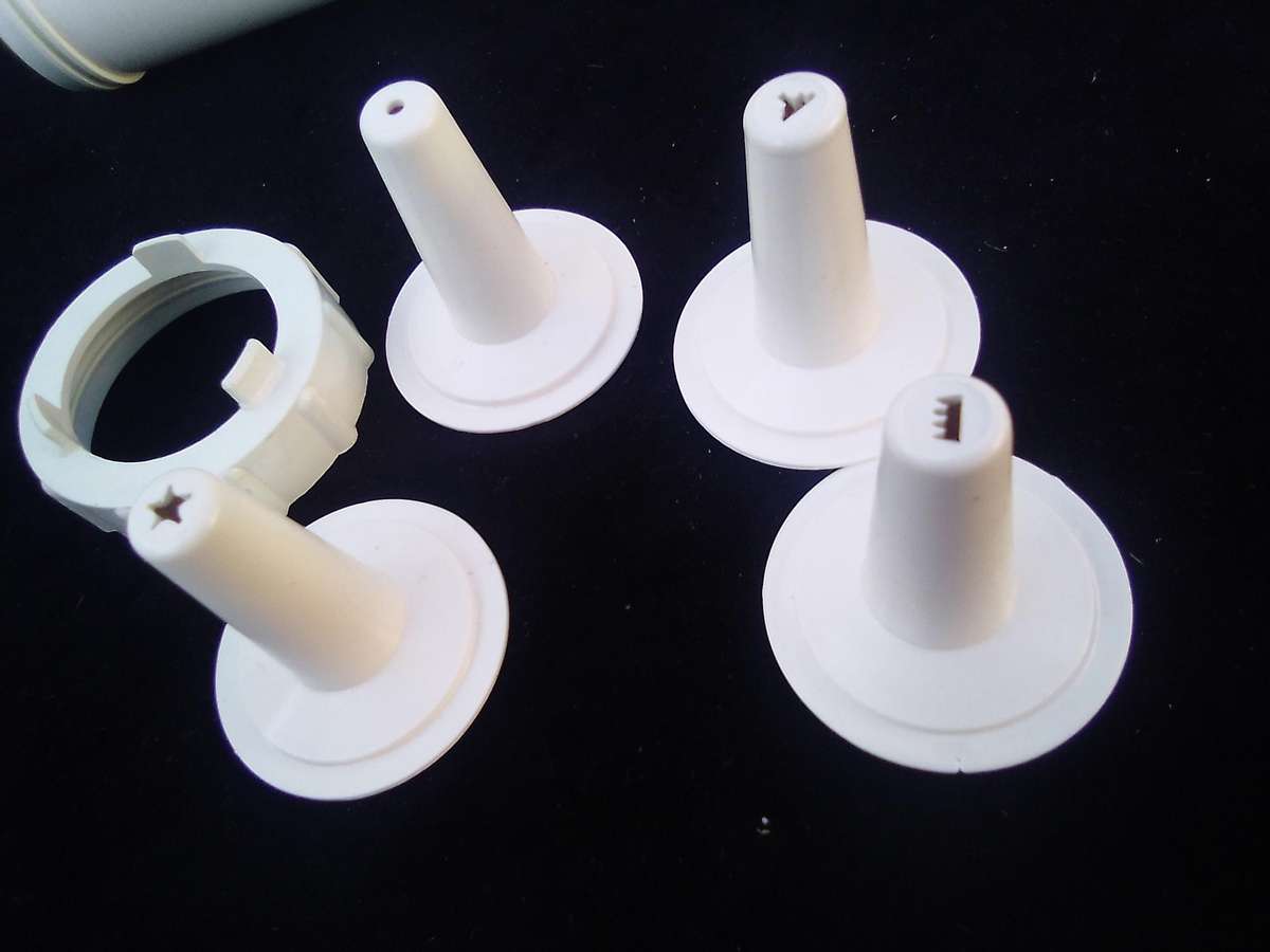 "Ideal" Biscuit and Icing Gun.  Metal trigger, tube and attachments are hard, white plastic.