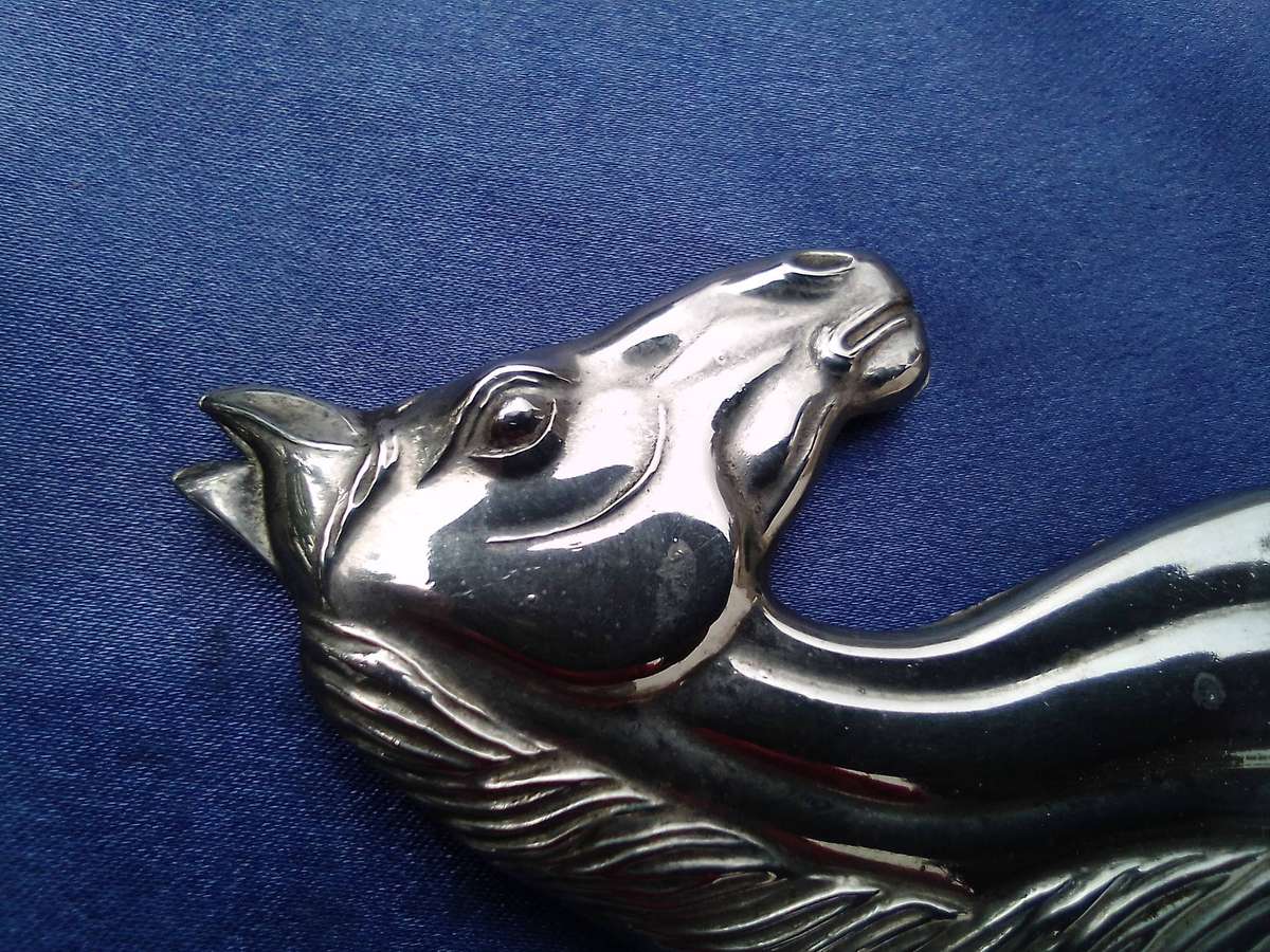 Horse - head, shaped bottle opener.