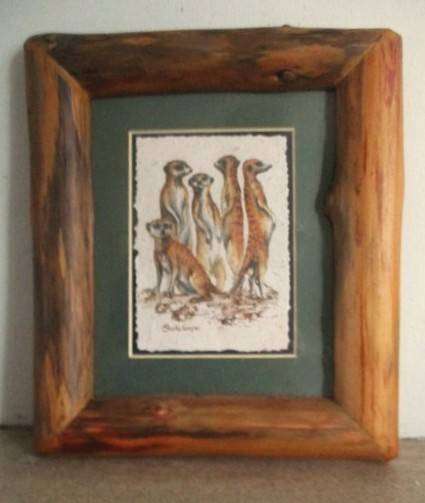 Charming Meerkat family on hand made dung paper framed in naturally foraged genuine Yellowwood frame