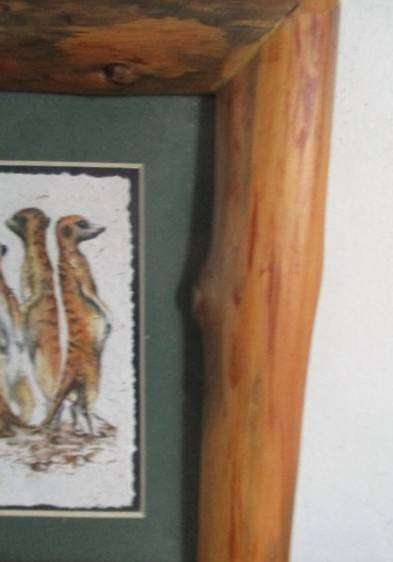 Charming Meerkat family on hand made dung paper framed in naturally foraged genuine Yellowwood frame
