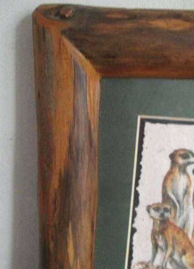 Charming Meerkat family on hand made dung paper framed in naturally foraged genuine Yellowwood frame