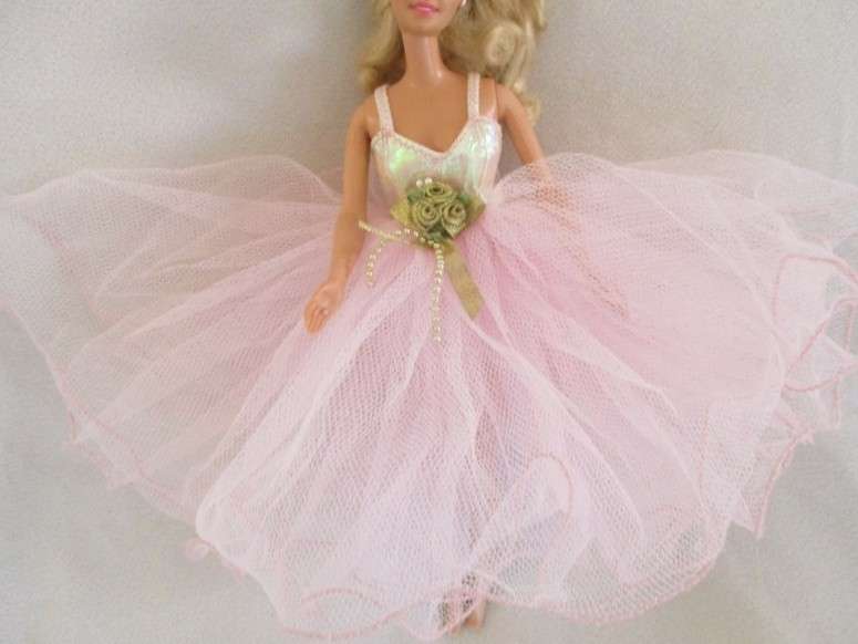 A Mattel Barbie in stunning dress with original earrings and ring - knees bend - great condition