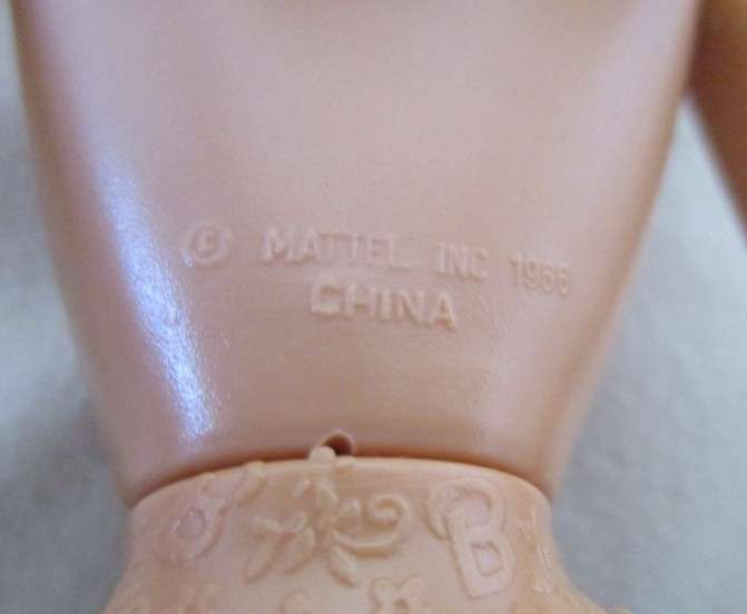 A Mattel Barbie in stunning dress with original earrings and ring - knees bend - great condition