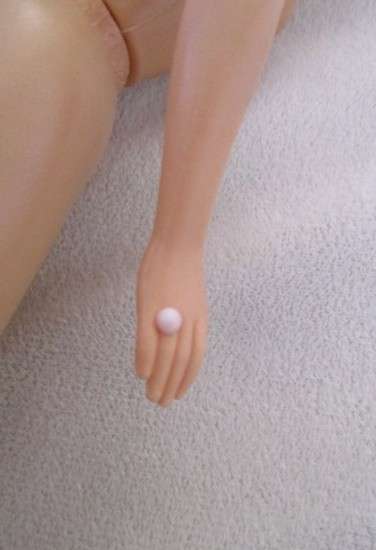 A Mattel Barbie in stunning dress with original earrings and ring - knees bend - great condition