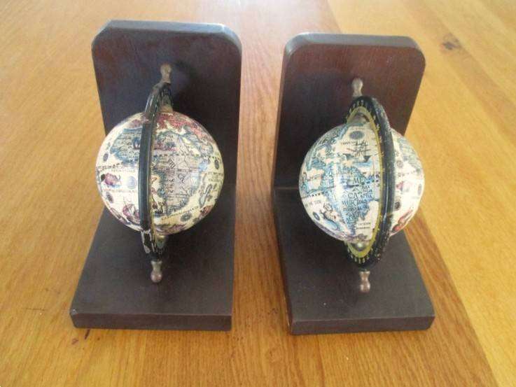 Two vintage World Globe Bookends with metal globes depicting antique maps