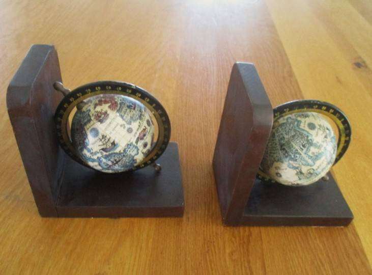 Two vintage World Globe Bookends with metal globes depicting antique maps