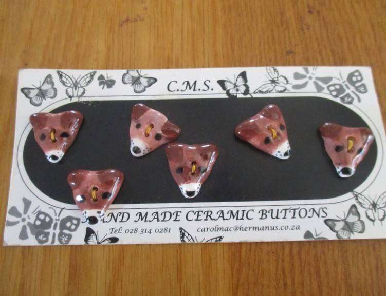 A card of six  hand made ceramic buttons - cute puppy dog faces
